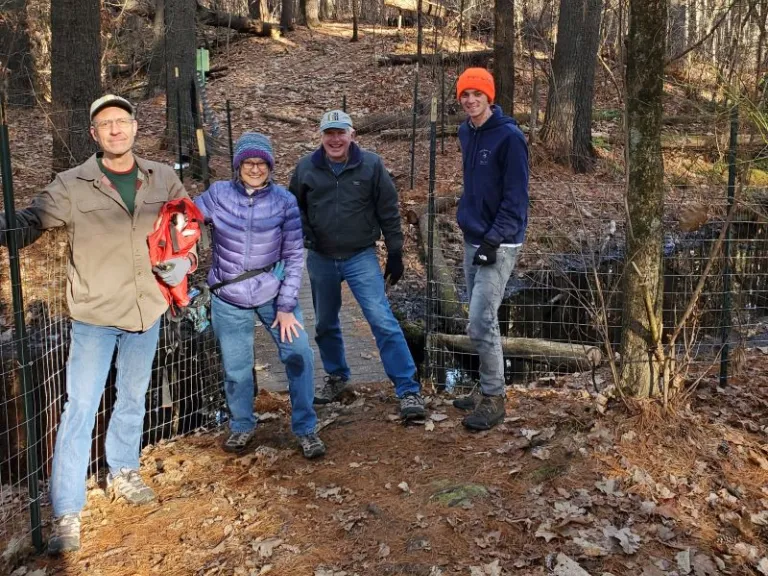 Jim Shelhamer, Kelsey Thompson, Terry Lockhart, and Jim Makuc (not pictured) worked on the fence with SVT's Chris Reardon.