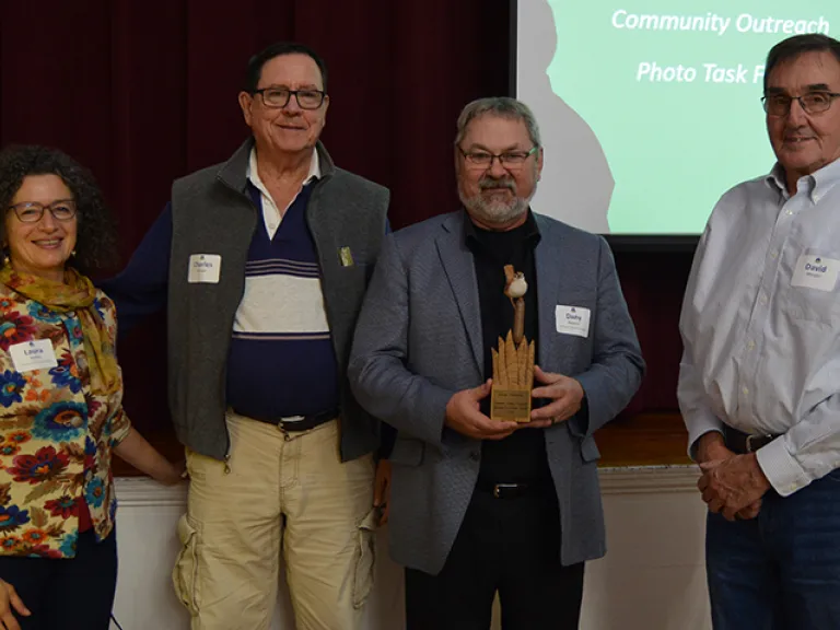 Laura Mattei and the Morgans present Morgan Volunteer Award to Dany Pelletier