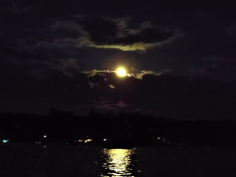The Moon over Bare Hill Pond in Harvard, photographed by Robin Right.