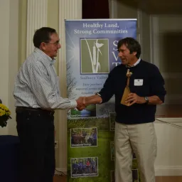 David Morgan (left) presents the Morgan Volunteer of the Year Award to Roland "Boot" Boutwell.