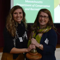 Meredith Hougton presents Christine A. Berry with the Distinguished Public Service Award